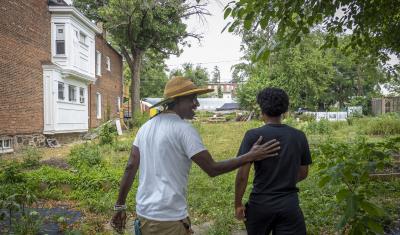 University of Maryland Extension Urban Farmer Field School holds an educational event at Plantation Park Heights Urban Farm (PPHUF) in Baltimore, Md., July 20, 2021.  PPHUF was created by Farmer Chippy (left) and a group of Caribbean/American citizens’ desire to effect change and have a positive impact on the lives of young adults like Farm Hand Elijah Bailey, 17, (right) that reside in the Park Heights community as well as focus on food production and distribution to create the first “Agrihood” within the 