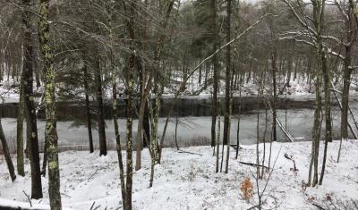 View of unfrozen Lamprey River in February 2020