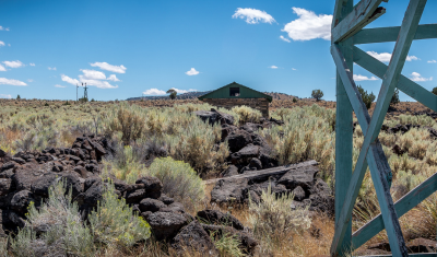 Restored water tower, with windmill and pump house in background, Camp Gap Ranch, Oregon BLM photo by Greg Shine