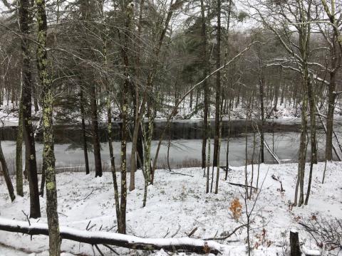 View of unfrozen Lamprey River in February 2020