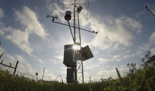 Sunny day looking at a mesonet tower