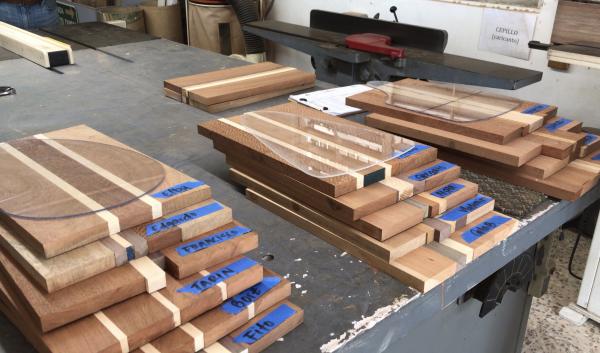 3 piles of wood blocks stacked on a work bench ready for use in the workshop